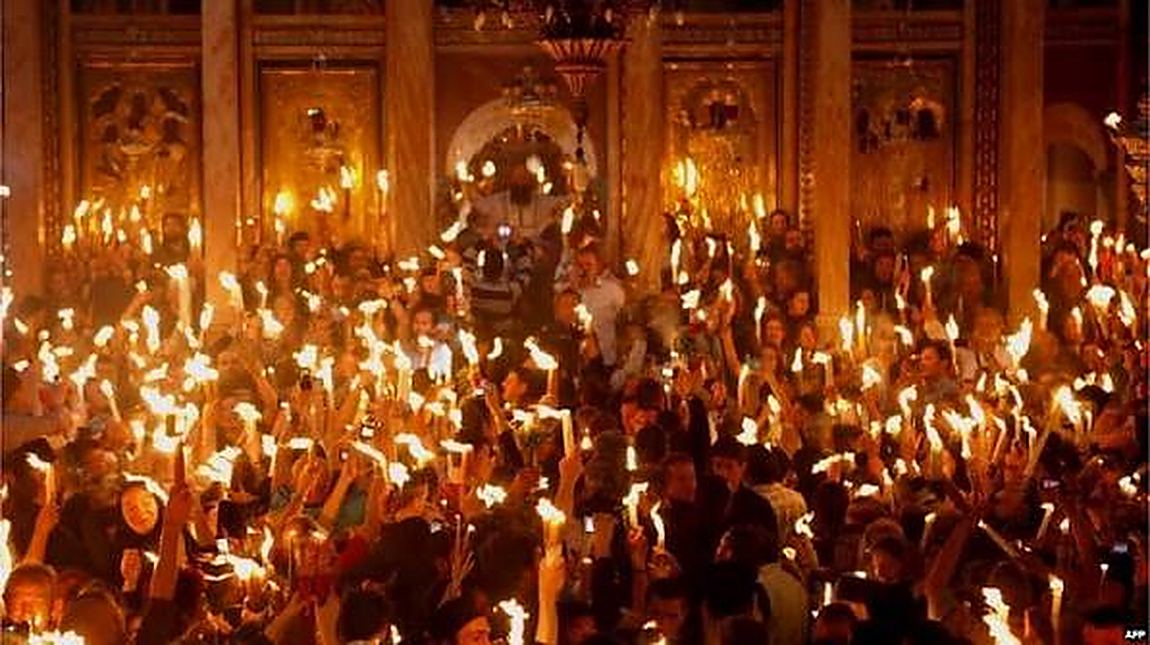 A church full of candles, and no other light