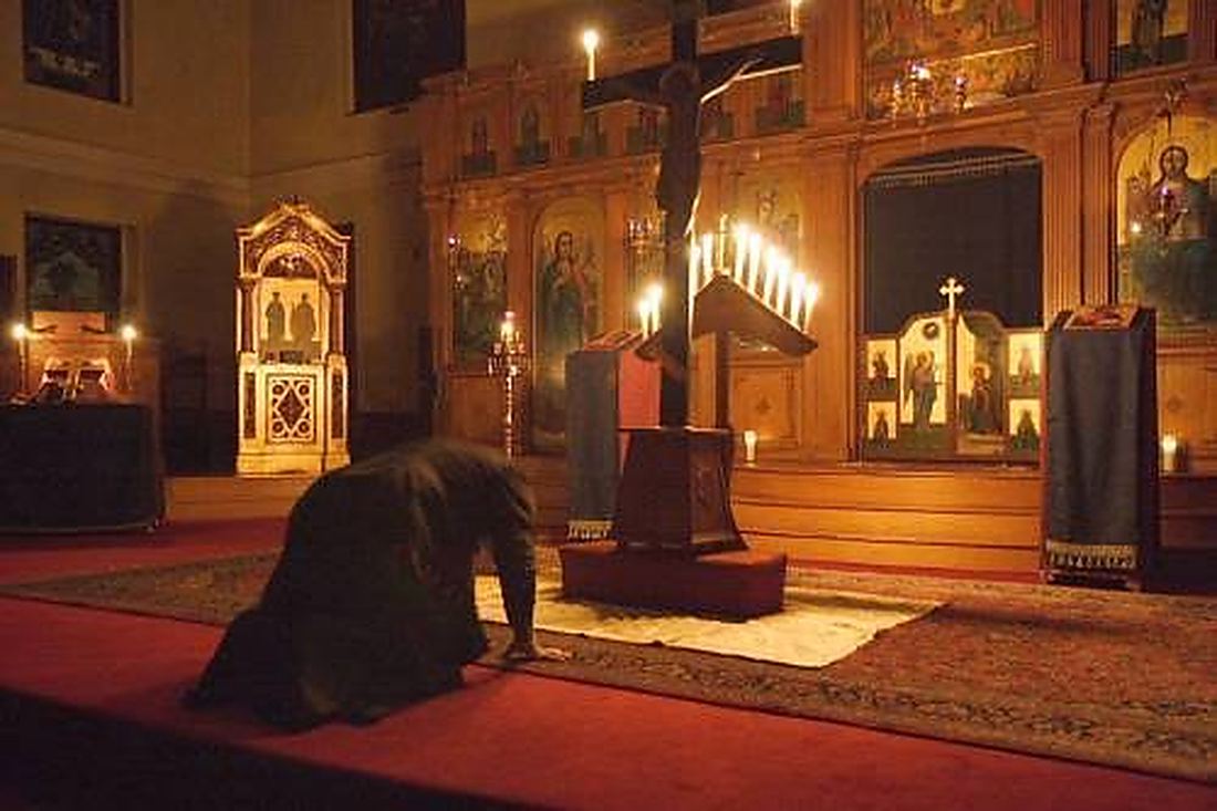 Before the tomb, on the ground