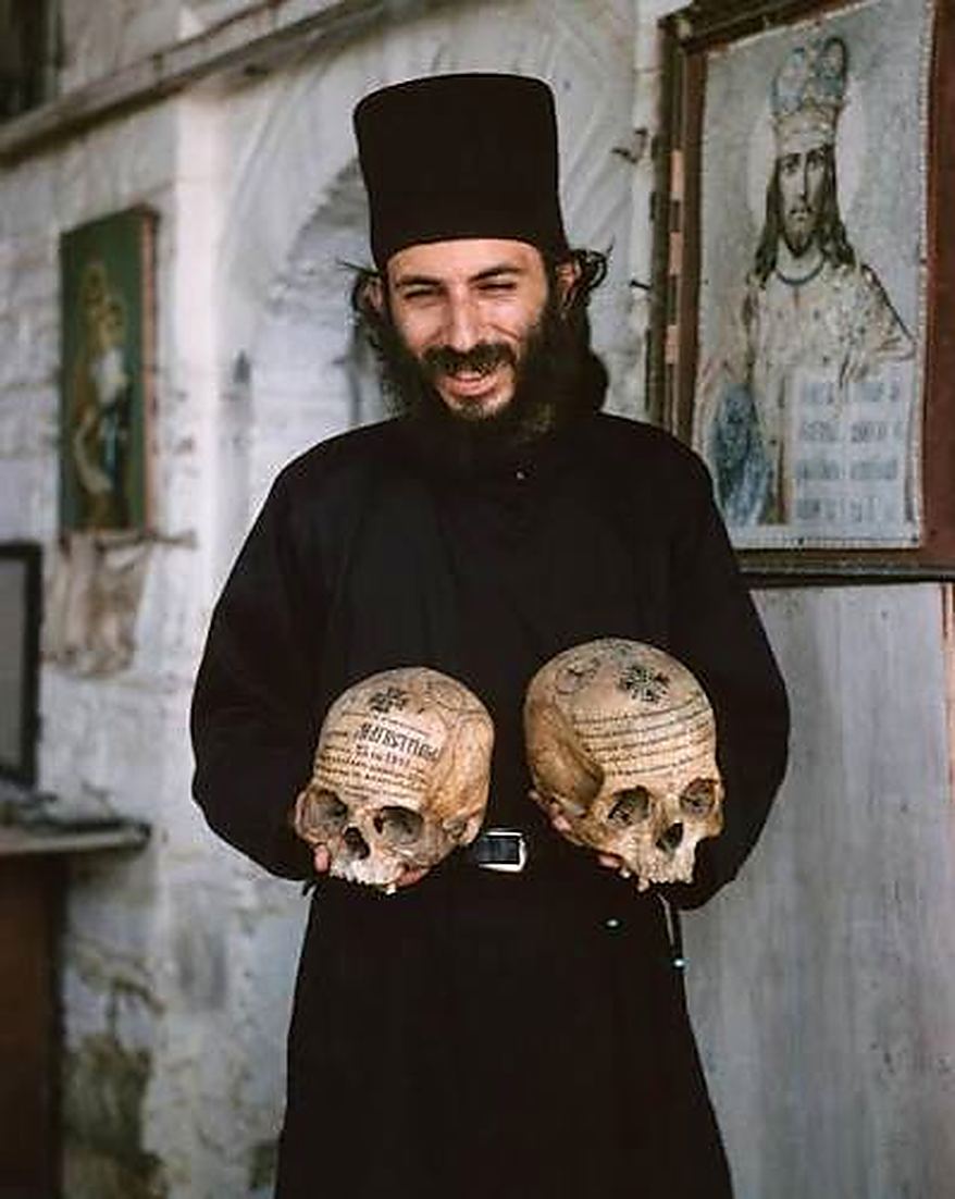 Two skulls, carried like books